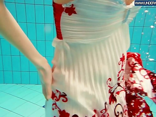 Molten Polish red-haired swimming in the pool